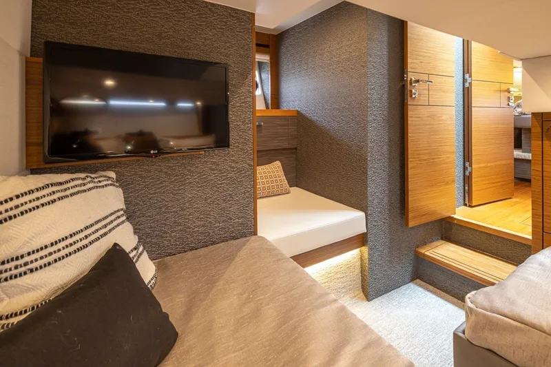 Slide: The Image of Interior of 2019 Tiara Yachts C44 Coupe with cozy seating and modern decor. - 26