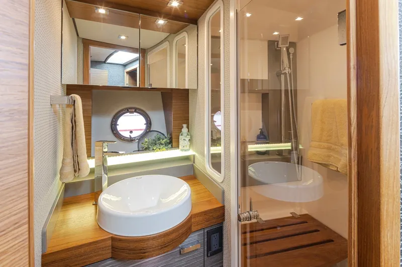 Slide: The Image of Luxurious bathroom interior of 2019 Tiara Yachts C44 Coupe with modern fixtures. - 22