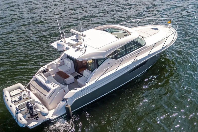 Slide: The Image of 2019 Tiara Yachts C44 Coupe cruising on open water, showcasing sleek design and luxury features. - 39