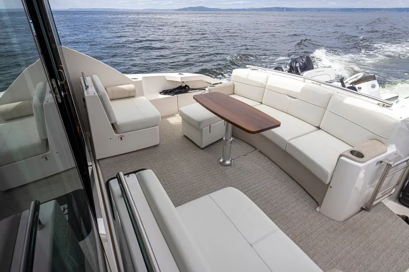 Slide: The Image of Luxurious 2019 Tiara Yachts C44 Coupe with spacious outdoor seating and ocean view. - 30