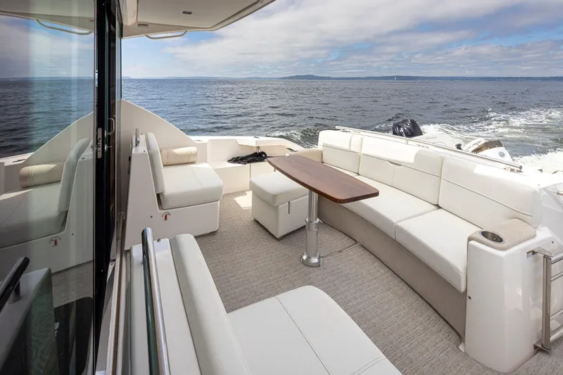 Slide: The Image of Luxurious 2019 Tiara Yachts C44 Coupe with elegant seating and ocean view. - 29