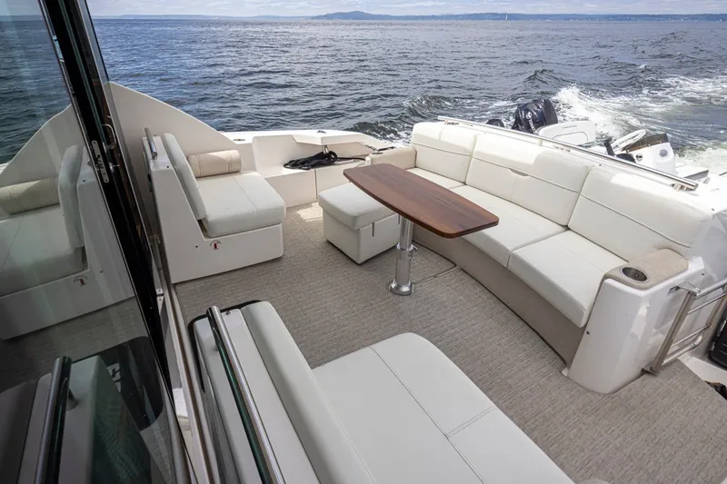 Slide: The Image of Luxurious 2019 Tiara Yachts C44 Coupe with spacious outdoor seating and ocean view. - 28