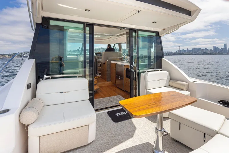 Slide: The Image of 2019 Tiara Yachts C44 Coupe with elegant interior and scenic waterfront view. - 32