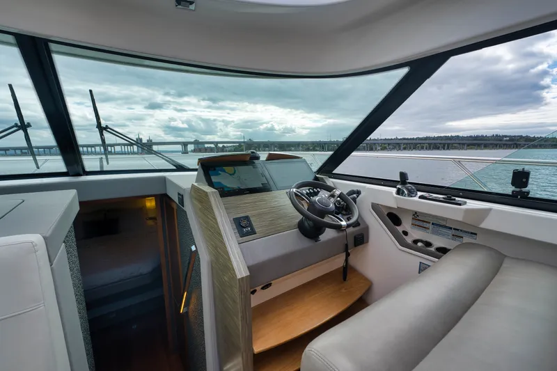 Slide: The Image of 2019 Tiara Yachts C44 Coupe helm with panoramic water view. - 21