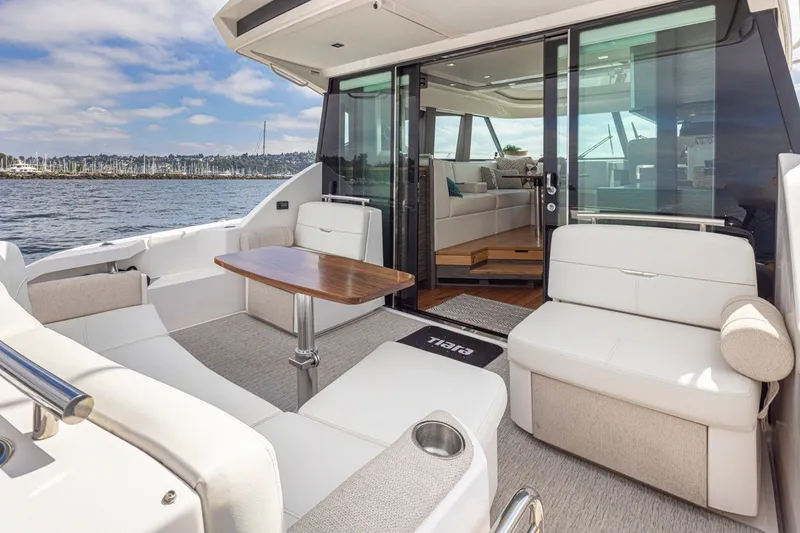 Slide: The Image of Luxurious 2019 Tiara Yachts C44 Coupe with elegant seating and scenic ocean view. - 31