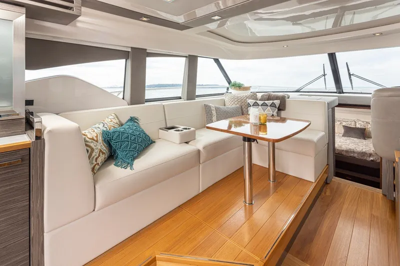 Slide: The Image of Luxurious interior of 2019 Tiara Yachts C44 Coupe with elegant seating and wooden flooring. - 6