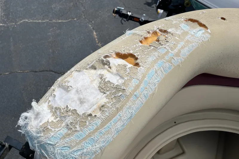 Slide: The Image of Damaged upholstery on 2014 Bentley Pontoons Elite 250 boat seat. - 12