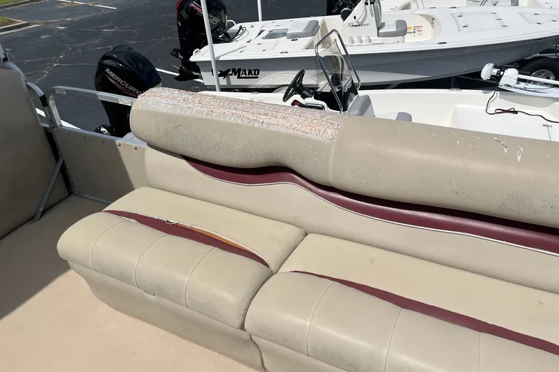 Slide: The Image of 2014 Bentley Pontoons Elite 250 with worn beige and maroon seating. - 10