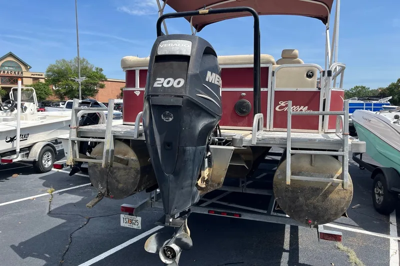 Slide: The Image of 2014 Bentley Pontoons Elite 250 with Mercury Verado 200 engine in parking lot. - 3