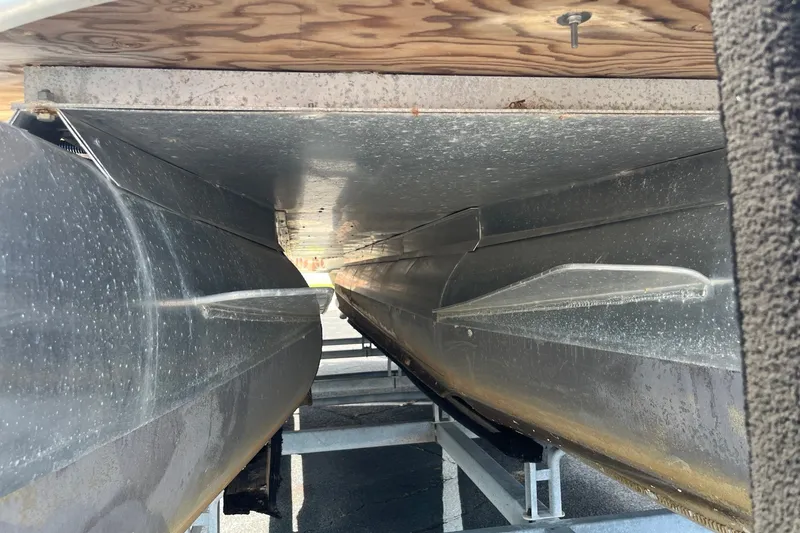 Slide: The Image of Underneath view of a 2014 Bentley Pontoons Elite 250, showcasing pontoons and structural details. - 5