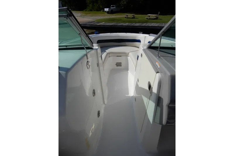 Slide: The Image of 2017 Chaparral 246 SSi boat interior with seating and storage compartments. - 24