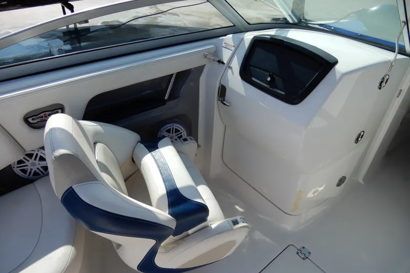 Slide: The Image of Interior of 2017 Chaparral 246 SSi boat with white and blue seating. - 17