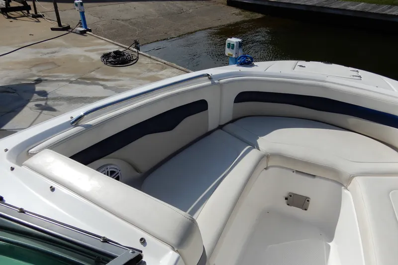Slide: The Image of 2017 Chaparral 246 SSi boat interior with white seating and blue accents. - 25