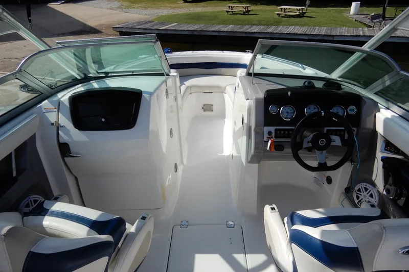 Slide: The Image of 2017 Chaparral 246 SSi boat interior with dual consoles and steering wheel. - 15