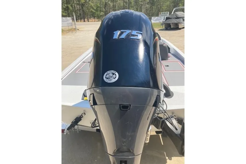 Slide: The Image of 2026 Xpress H20 Crappie boat with a 175 horsepower engine, parked outdoors. - 6