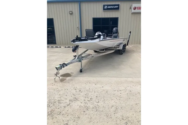 Slide: The Image of 2026 Xpress H20 Crappie boat on trailer outside dealership. - 2