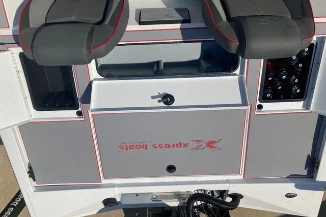 Slide: The Image of The image shows the helm of an Xpress H20 Crappie boat with gray and red accents. - 16