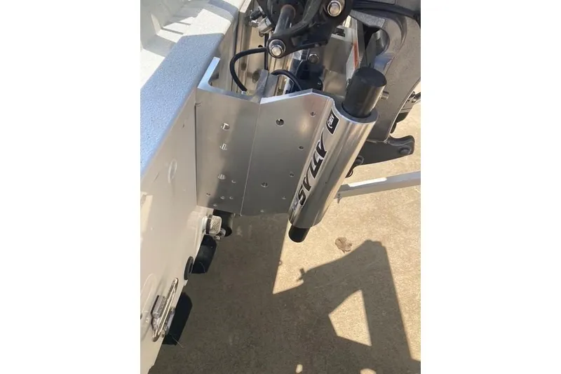 Slide: The Image of 2026 Xpress H20 Crappie boat transom with hydraulic steering components. - 22