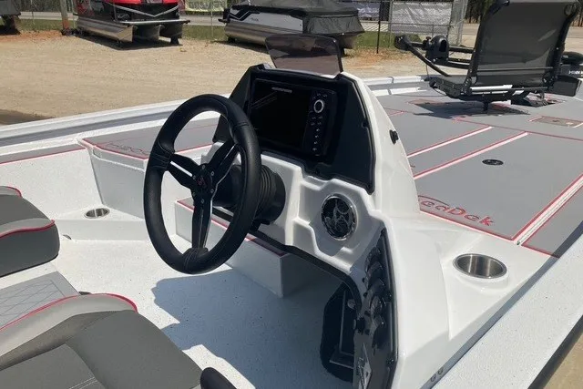 Slide: The Image of 2026 Xpress H20 Crappie boat interior with steering wheel and control panel. - 12