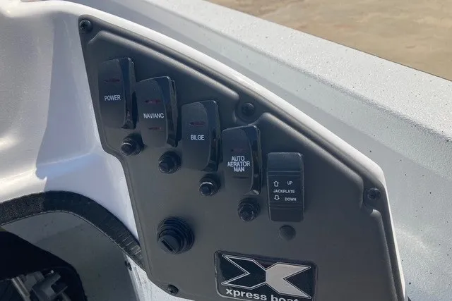 Slide: The Image of Control panel of 2026 Xpress H20 Crappie boat with labeled switches. - 15
