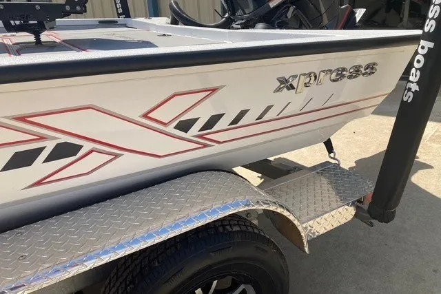 Slide: The Image of 2026 Xpress H20 Crappie boat on trailer, featuring sleek design and graphics. - 5
