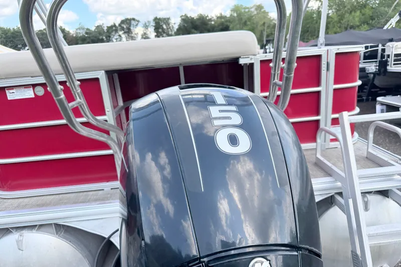Slide: The Image of 2016 Sylvan Mirage 8520 pontoon boat with T50 outboard motor, red and silver design. - 3