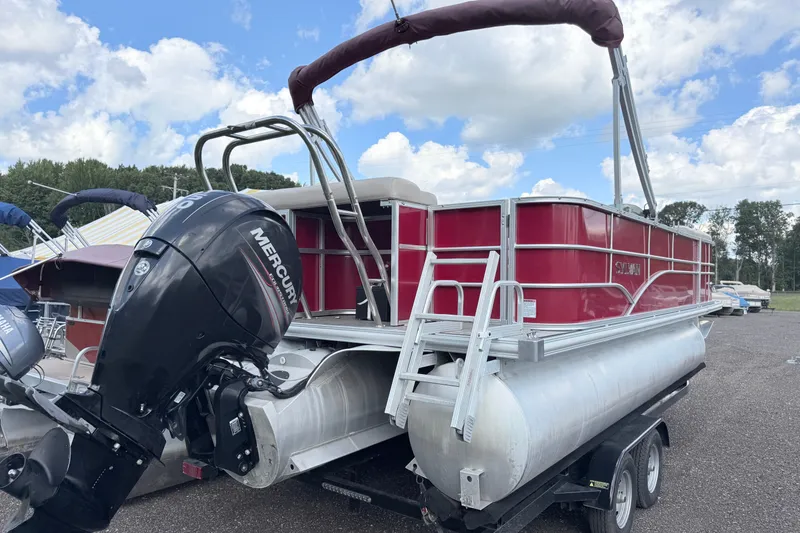 Slide: The Image of 2016 Sylvan Mirage 8520 pontoon boat with Mercury outboard motor on a trailer. - 2
