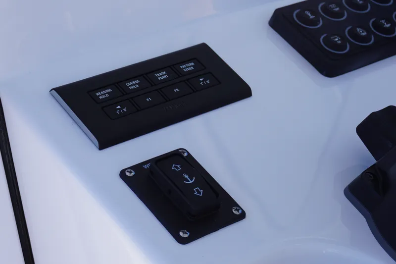 Slide: The Image of Control panel of 2027 Sportsman Open 282 Center Console boat, featuring navigation buttons. - 19