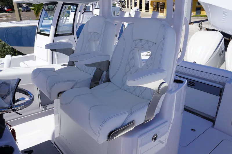 Slide: The Image of 2027 Sportsman Open 282 Center Console boat with luxurious white seating. - 23