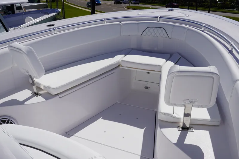 Slide: The Image of 2027 Sportsman Open 282 Center Console boat interior with white seating and spacious layout. - 27
