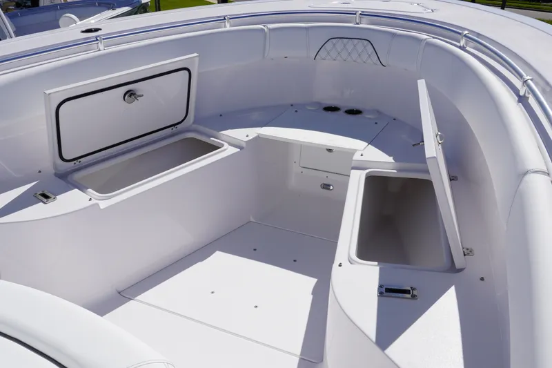 Slide: The Image of 2027 Sportsman Open 282 Center Console boat interior with open storage compartments. - 25