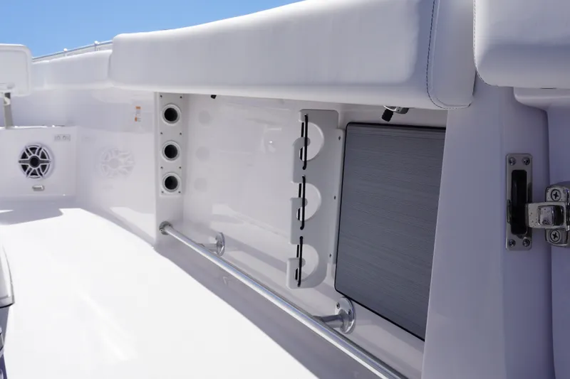 Slide: The Image of 2027 Sportsman Open 282 Center Console interior with rod holders and speakers. - 17