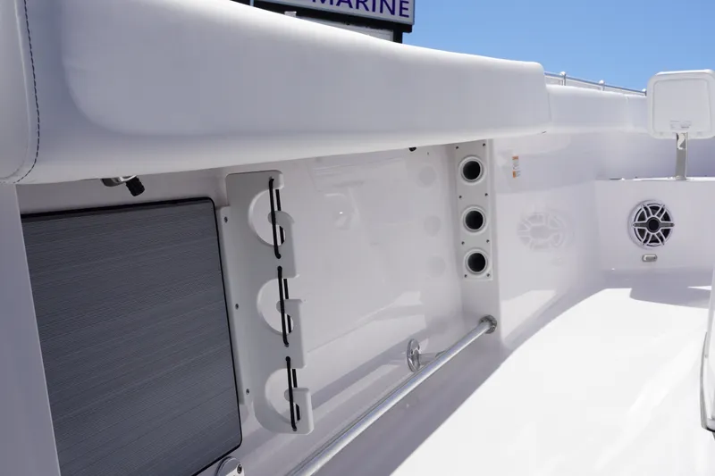 Slide: The Image of 2027 Sportsman Open 282 Center Console interior with rod holders and speaker. - 16