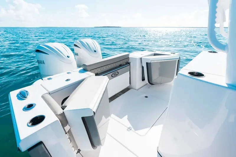 Slide: The Image of 2027 Sportsman Open 282 Center Console boat on clear blue ocean water. - 14