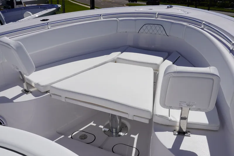 Slide: The Image of 2027 Sportsman Open 282 Center Console boat with white cushioned seating area. - 28