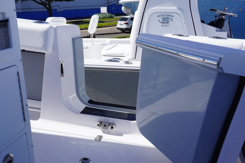 Slide: The Image of 2027 Sportsman Open 282 Center Console boat interior with open storage compartment. - 15