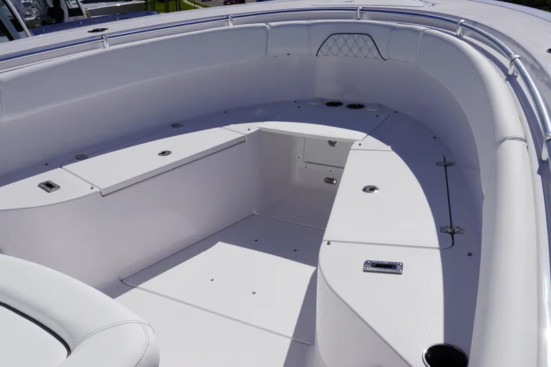 Slide: The Image of 2027 Sportsman Open 282 Center Console boat interior with seating and storage compartments. - 24