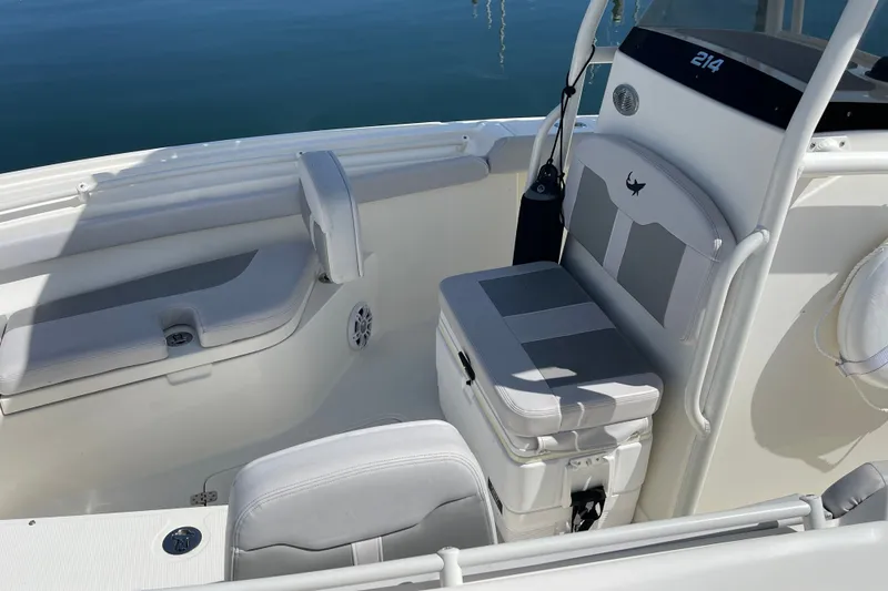 Slide: The Image of 2023 Mako 214 Center Console boat interior with seating and storage. - 21