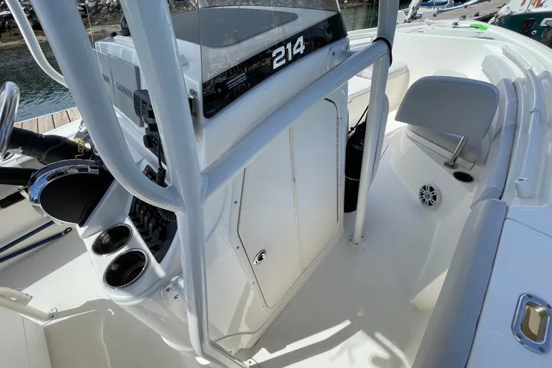 Slide: The Image of 2023 Mako 214 Center Console boat interior with steering wheel and control panel. - 33