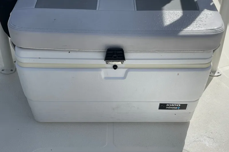 Slide: The Image of Cushioned Igloo Marine cooler on 2023 Mako 214 Center Console boat deck. - 40