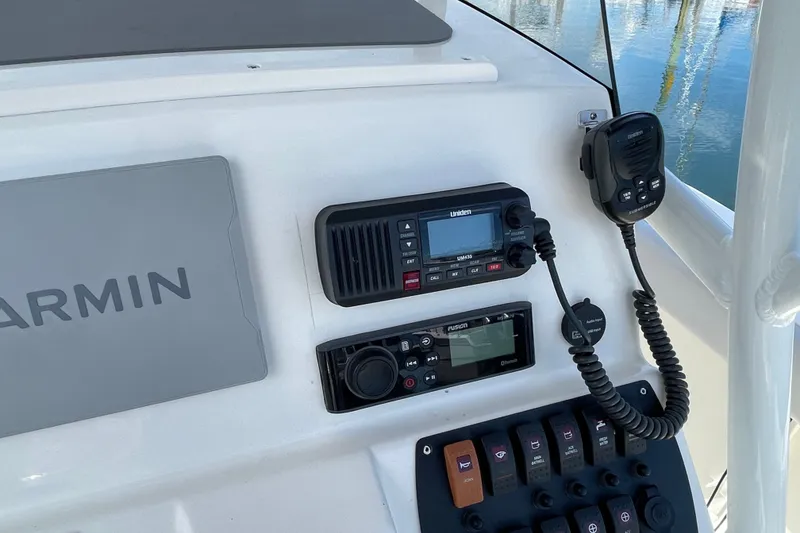 Slide: The Image of Control panel of 2023 Mako 214 Center Console with Garmin and Uniden equipment. - 29