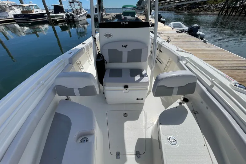 Slide: The Image of 2023 Mako 214 Center Console boat interior at marina dock. - 37