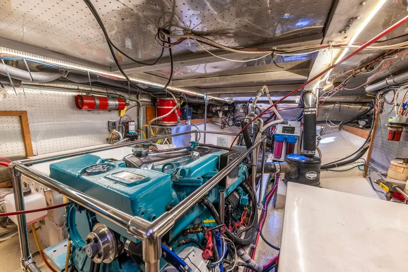 Slide: The Image of Engine room of a 1991 Kadey-Krogen 42 yacht, featuring a well-maintained engine. - 61