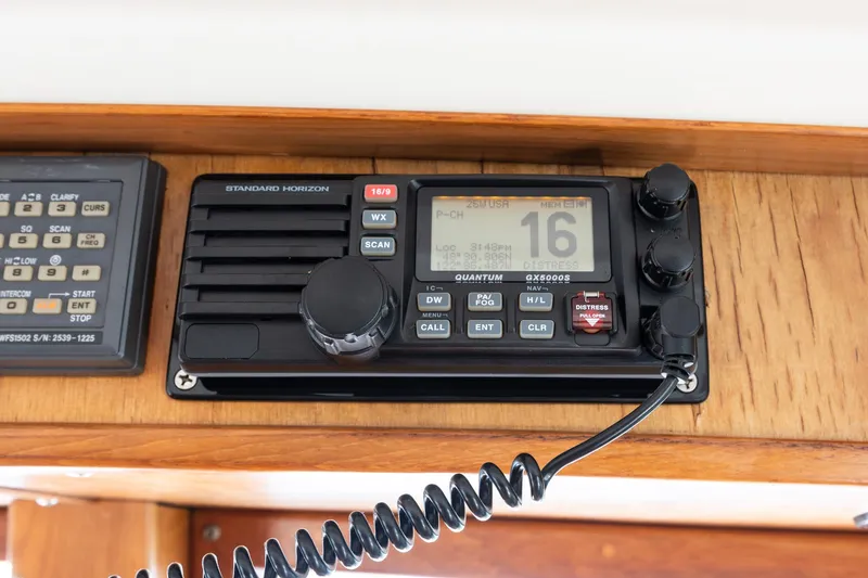 Slide: The Image of Standard Horizon radio on 1991 Kadey-Krogen 42 boat, featuring distress and communication controls. - 36