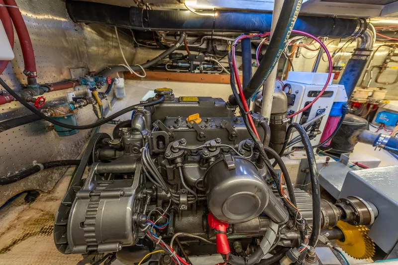 Slide: The Image of Engine room of a 1991 Kadey-Krogen 42 boat, showcasing detailed machinery and wiring. - 67