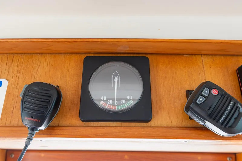Slide: The Image of Boat dashboard with compass and communication devices, Kadey-Krogen 42, 1991 model. - 33