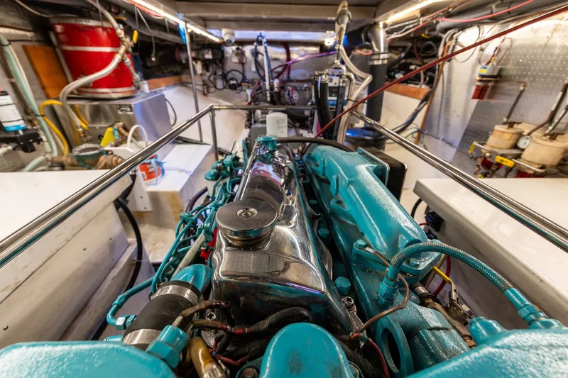 Slide: The Image of Engine room of a 1991 Kadey-Krogen 42 yacht, showcasing detailed machinery and components. - 66