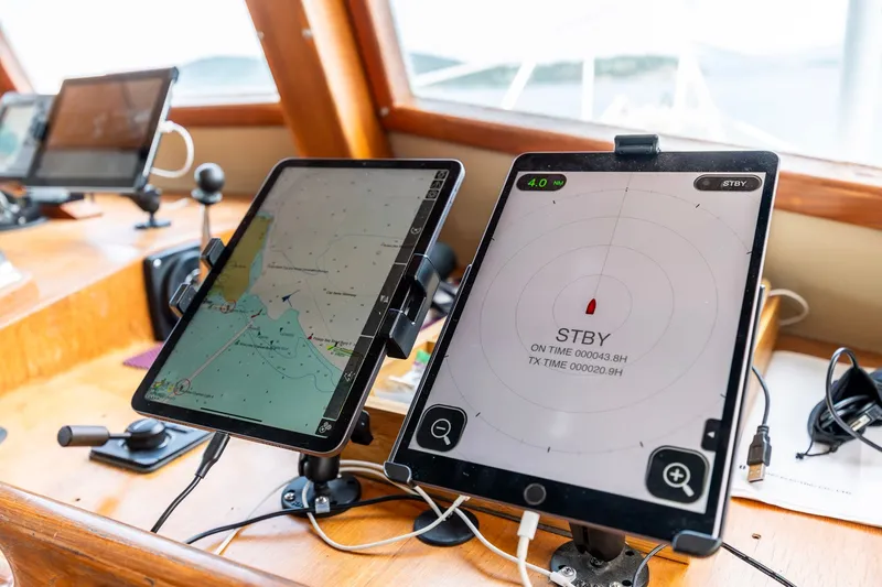 Slide: The Image of Navigation tablets on Kadey-Krogen 42 yacht, 1991 model, displaying maps and radar. - 42
