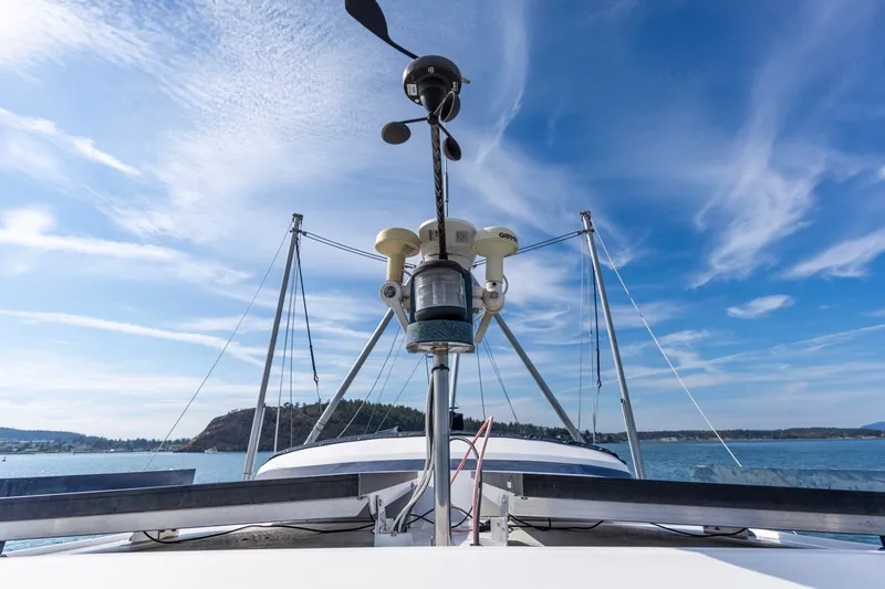 Slide: The Image of Kadey-Krogen 42 boat, 1991 model, with navigational equipment against a clear blue sky. - 46