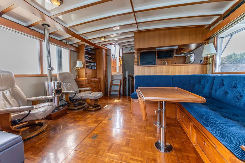 Slide: The Image of Luxurious 1991 Kadey-Krogen 42 yacht interior with plush seating and elegant wood finishes. - 7